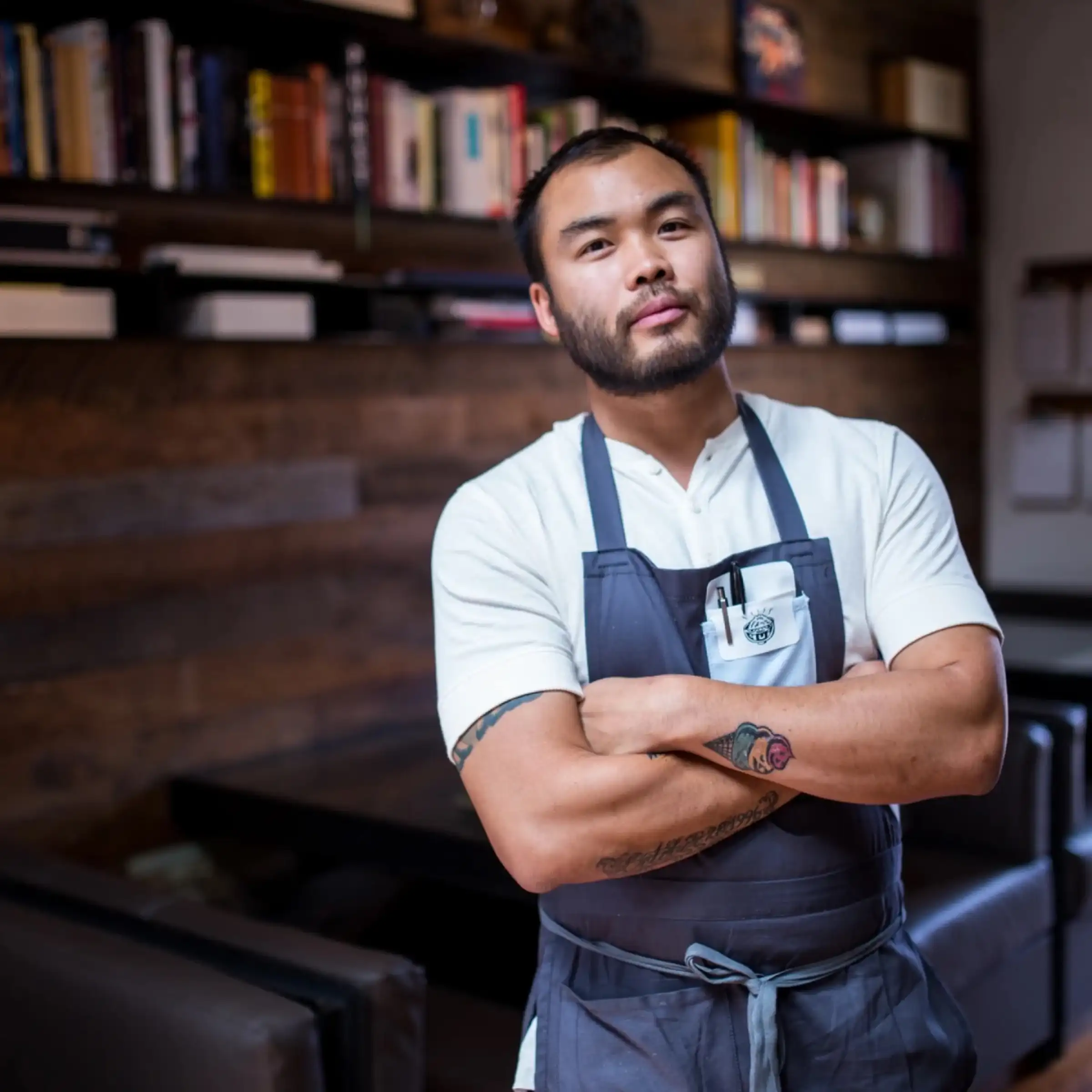 Chef Paul Qui composing a plate at the Kitsu Nori counter