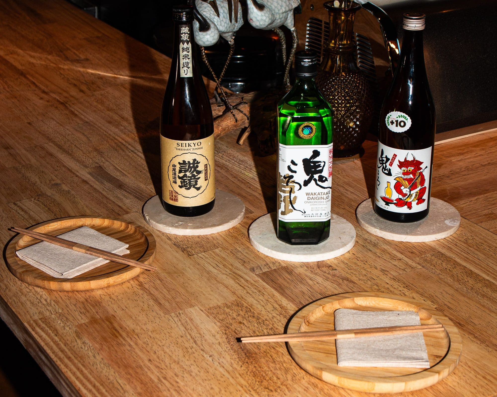 The sake selection and warm wood counter at Kitsu Nori on South Lamar
